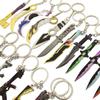 Varorant periférico intrépido contrato púrpura oro cuchillo garra hacha dorada fanático AK mini juguete llavero traje