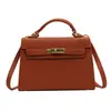 Bolso de alta calidad estilo western mini portátil tipo Kelly para mujer, nuevo de moda otoño e invierno 2023, bolso de hombro cruzado versátil