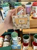 Bolsa Quadrada Pequena de Mão Estampada Nova Porta-Moedas Estilo Luxo Leve Armazenamento de Fone de Ouvido Bolsa Pequena Transversal com Corrente
