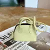 Bolso de mano coreano ins nuevo y versátil de color liso, nicho, con colgante de concha simple y bolso pequeño