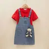 Conjunto de dos piezas de falda con tirantes de mezclilla para niñas, conjunto de verano moderno y a la moda para bebés, traje casual de manga corta para niños
