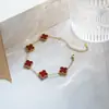 Set de trébol de cuatro hojas de acero de titanio de doble cara transfronterizo de Amazon: pulsera, collar, pendientes, anillo, juego de cuatro piezas, joyería que no se decolora