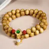 Pulsera de madera de nanmu dorada para mujer, pulsera de cuentas redondas de doble capa, joyería vintage de nicho de lujo ligero, accesorio de pulsera DIY de doble bucle