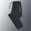 Pantalones de verano transpirables de secado rápido para hombre de talla grande, pantalones elásticos de seda helada, frescos y transpirables, elásticos, holgados y casuales para exportación