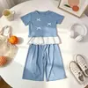 Verano 2026 Nuevo Estilo Coreano Ropa Infantil Top de Encaje con Lazo de Manga Corta Pantalones de Pierna Ancha Elegante Conjunto de Dos Piezas para Niñas