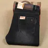 Pantalones grandes negros y grises sueltos para hombre otoño e invierno nuevos de algodón elástico cálidos con forro polar engrosado jeans para hombre