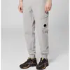 Pantalones de lente europeos y americanos transfronterizos CP multibolsillo de ocio y deportivos funcionales cortavientos para hombre y mujer CP de pierna estrecha venta al por mayor