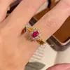 Popular en Xiaohongshu: Anillo de lujo tejido de rubí pigeon blood de corte transversal, pendientes de diamante rojo de lujo ligero, engaste de diamante de alto carbono