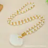 Collar con colgante Ruyi de seguridad de jade Hetian de alta calidad, cadena para suéter, todo tipo de fabricantes de jade Hetian de imitación al por mayor