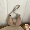 Bolso de Luna Retro de Diseño de Nicho Invierno 2025 Color Sólido Bolso de Hombro Popular Bolso de Mano Texturizado para el Trabajo