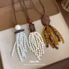 Collar con Borla de Cordón de Cuero, Madera, Resina, Perla y Piedra Ojo de Tigre Cadena para Suéter Estilo Melard Accesorio para el Cuello Casual Sencillo Versátil