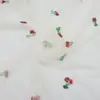 Nuevo Tejido de Malla Bordado con Lentejuelas de Cereza Roja Fabricante Stock Listo Malla Suave de Poliéster Tejido para Ropa y Vestidos Bordados