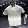 Novo suéter de malha de manga curta para primavera e verão para homens, com gola redonda, padrão jacquard e um design de pullover moderno