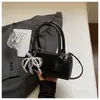 Bolso cilíndrico de mano de nicho coreano para mujer, nuevo y moderno bolso de boliche de verano 2026, bolso de hombro y cruzado con textura de alta calidad