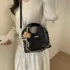 Bolso Cubo Retro de Gama Alta para Viajeros 2026 Nuevo Estilo Bolso de Mano Rombo Moda de Nicho Bolso de Hombro Cruzado