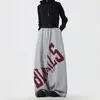Calça de moletom americana de rua com estampa de letras grandes e cintura elástica para homens e mulheres, calça larga casual versátil para dança jazz, perna larga