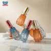 Botella gotero de vidrio Xinmei, Botella de aceite esencial, Botella de líquido de esencia, Botella vacía de alta gama con pulverizador, color dorado esmerilado, estampado personalizado