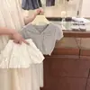 Nuevo Conjunto de Verano para Niña 2026 Bebé Niña Cuello Azul Marino Manga Corta Tejido Falda Floral Elegante Conjunto de Dos Piezas