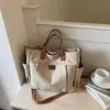 Bolso tote de hombro casual de lona de gran capacidad para el trabajo y los desplazamientos, simple y elegante, de alto valor, color liso, moderno