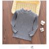 Una generación de suéter base para niños, camisa de cuello medio alto de color sólido de punto ajustado para otoño e invierno. Nueva camisa elástica
