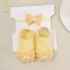 Conjunto Transfronterizo Europeo y Americano de Nuevo Estilo para Bebé: Diadema y Calcetines, Diadema Elástica de Mariposa para Bebé y Accesorios para la Cabeza