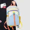 Mochila de viagem color-blocking com cor dopamina transfronteiriça, mochila de grande capacidade para homens e mulheres, mochila multifuncional para caminhada ao ar livre e fitness
