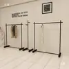 Estante de exhibición para tienda de ropa perchero negro para tiendas de ropa de mujer y niño estante de pie estante de arte de hierro isla de exhibición perchero para vestidos