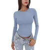 2026 Amazon nueva camiseta básica versátil de manga larga con cuello redondo, corte ajustado, estilo europeo y americano, para primavera y otoño, color liso, corte ajustado para mujer