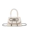 Bolsa Texturizada Estilo Francês Niche para Mulheres Verão 2025 Novo Estilo Bolsa Quadrada Pequena com Laço Bolsa de Ombro Transversal Estilosa