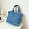 Bolsa de mezclilla se puede personalizar logo impreso estilo liso bolso de mano gran capacidad bolso artístico de mano mini bolsa tote