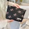 Nuevo Bolso de Cosméticos Jacquard en Relieve de Alta Calidad Gran Capacidad Sentido de Alta Gama Bolso de Mano Portátil Bolsa de Almacenamiento de Lona