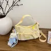 Bolsa de nylon estilo coreano con cordón de gran capacidad para mujer, nueva bolsa cruzada de un solo hombro de nicho 2026, bolsa de mano plisada para la escuela