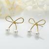 Pendientes de perla con lazo sencillo personalizados, elegantes pendientes retro de moda de Corea del Sur, accesorios para las orejas que combinan con todo para estudiantes y mujeres.