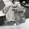 Traje de Verano de Manga Corta para Niños 2026 Nuevo Guapo Bebé Ropa Inglesa Conjunto Casual de Dos Piezas a la Moda Infantil Moderno