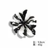 Nueva colección de broches de flor de acrílico con diseño vintage, borlas de camelia, accesorios para mujer, joyería transfronteriza al por mayor