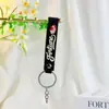 Novo chaveiro pulseira de borracha macia pingente de bolsa acessório pulseira de couro chaveiro fofo de PVC pulseira de borracha macia atacado