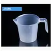 Taza medidora para hornear, plástico transparente, grado alimenticio para el hogar, con escala, vaso de precipitados, cilindro graduado, engrosada, taza pequeña de cocina para té con leche