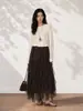 Falda asimétrica de retazos de encaje de diseñador Feiyuan para mujer, nueva para principios de otoño, de cintura alta, adelgazante, color liso, línea A, falda de malla