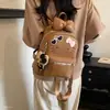 Nova Bolsa de Ombro Único 2026 Feminina Outono Cartoon Menina Mochila Inclinada Grande Capacidade Fofa de Mão Dupla Ombro