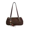 Otoño 2026 Nuevo Retro Simple Estampado de Leopardo Diseño de Nicho Personalidad Moda Bolso de Mano Bolso de Hombro Baguette Bolso para Mujer