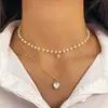 Collar Clavícula Retro Francés de Imitación Perla con Borla de Corazón de Tres Capas Apilable Europeo y Americano Nicho Temperamento de Gama Alta para Mujeres