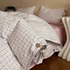 Nuevo conjunto de cuatro piezas de algodón y lino estilo botón simple de lujo ligero, estilo minimalista de Instagram, conjunto de tres piezas de hilo de rizo de algodón puro para ventas transfronterizas