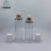 En stock 30g-120ml botella de vidrio redonda recta con atomizador Botella vacía de vidrio para loción y esencia Botella para set de cosméticos de crema