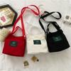 Bolso de mujer nuevo estilo coreano, bolso de lona sencillo y artístico para chica, bolso de cubo de moda de color sólido fresco, bolso cruzado informal moderno