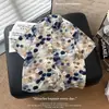 2026 Novo Estilo de Verão Camisa Masculina Fresca de Seda de Gelo Floral Retrô Solta Tendência Floral Casual de Manga Curta
