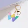 Llavero de Resina Color Arcoíris Letra Inglesa Borla Colgante Creativo Alto Sentido Gota de Pegamento de Cristal Colgante de Bolso