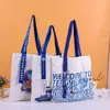 Bolsa de lona simples da moda com impressão colorida para publicidade, sacola de compras de algodão, bolsa de ombro de lona atacado