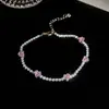 [Cadena de Diamantes Arcoíris] Pulsera de extracción de zircón trenzado en cruz, una pulsera lujosa y de alta gama, una pieza de joyería delicada y de moda