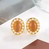 Pendientes Ovalados de Perla y Piedra Ojo de Gato Retro Franceses 2024 Nuevo Estilo Caliente Diseño de Nicho Pendientes de Gama Alta