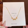 Collar de Flor Hueca Dorada para Mujer Lujo Ligero Exquisito Sentido de Diseño de Nicho Cadena para Clavícula Moda Accesorios Versátiles Venta al por Mayor